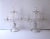 A beautiful pair of two arm, three light, transparent glass candelabras with crystal drop prisms and removable bobeches,...