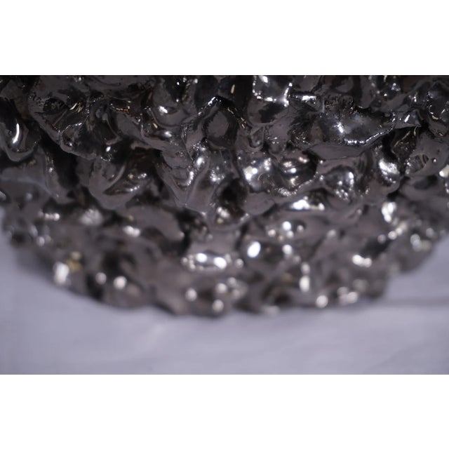 This signed and dated 2007 vase sculpture by British artist Abigail Ozora Simpson embodies her signature fusion of raw...