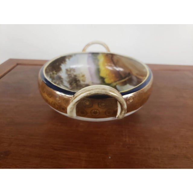 This is a Antique Noritake Hand Painted Double Handled Scenic Bowl, M Mark, Made in Japan. It measures 2 7/8" high to the...