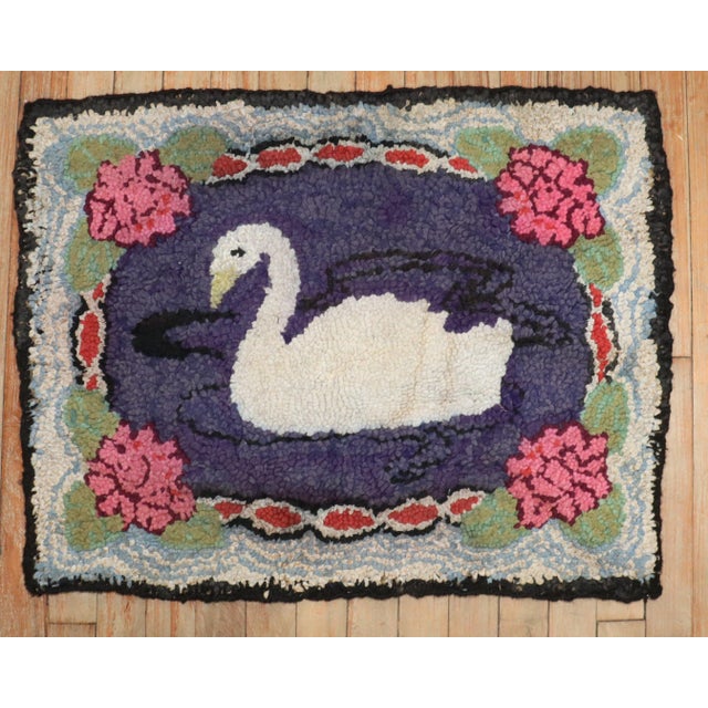 A handmade mini-size American hooked rug from the middle of the 20th century showing a duck Measures: 2' x 2'6''.