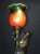 A striking french figural table lamp attributed to a.j. Scottie, dating to circa 1900, combining sculptural metalwork with...