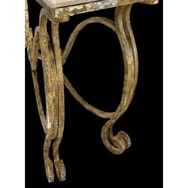 Patinaed, heavy iron and light brown marble console. A sophisticated addition to your interior.