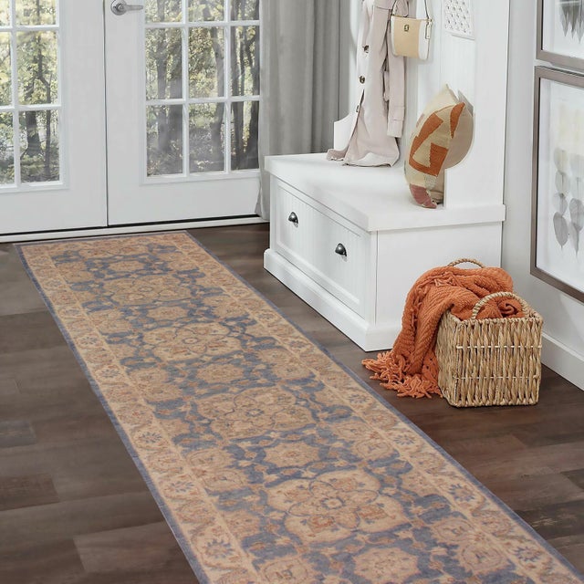 Enhance the ambiance of your home with this magnificent Persian-influenced Turkish hand-knotted rug made by skilled...
