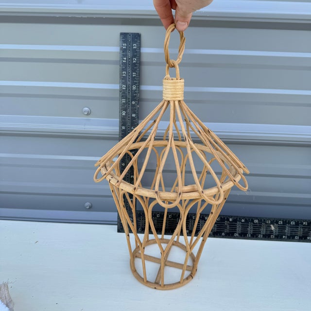 Vintage rattan bird cage. Two pieces. Top can be removed. Top is secured by moving a small rattan latch. Would be neat to...