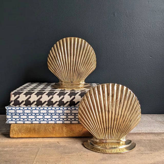 Seashell vintage brass bookends. These lovely MCM bookends are made from solid cast brass and have been polished to a...