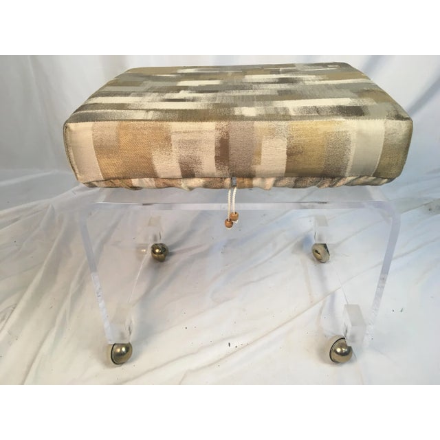 This cute lucite stool on casters has been redone. We added a custom cushion with a great fabric that will match almost...
