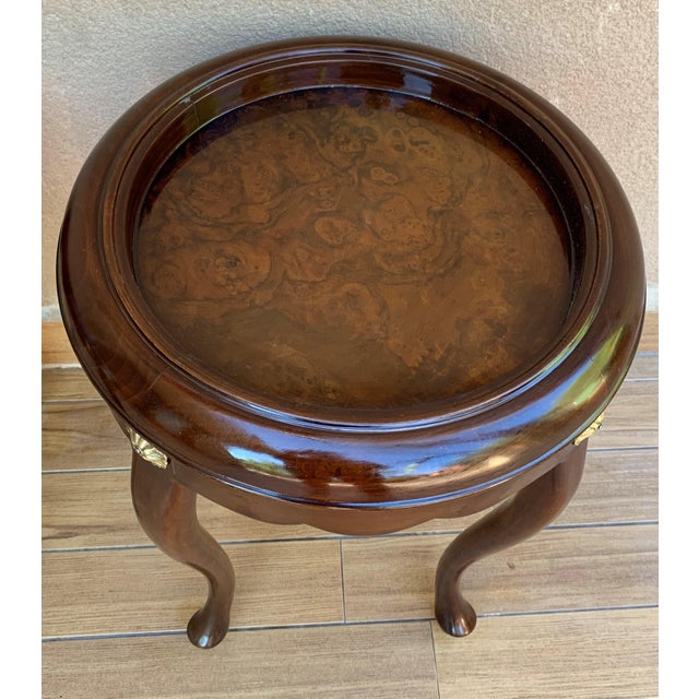 An eye-catching elegant round flame mahogany and burl side table Having wonderful decorative pinwheel pattern on top with...