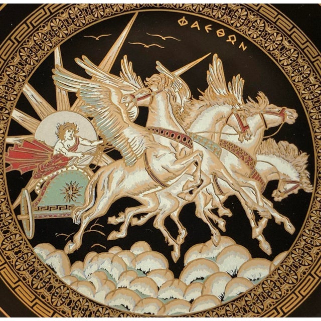 Vintage black porcelain decorative wall plate with 24k gold hand painted Greek warriors on horse chariot 1970's. Hand made...