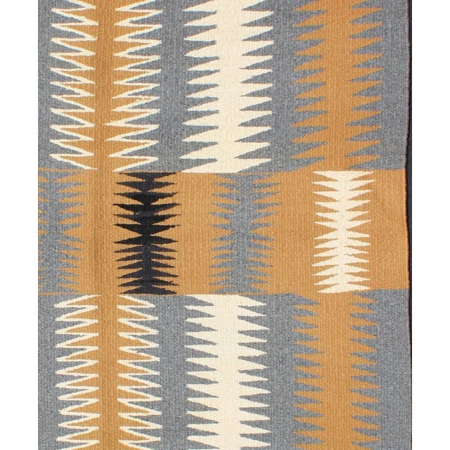 This intriguing antique Navajo Kilim, circa 1940 was woven in the United States during the first half of the 20th century....