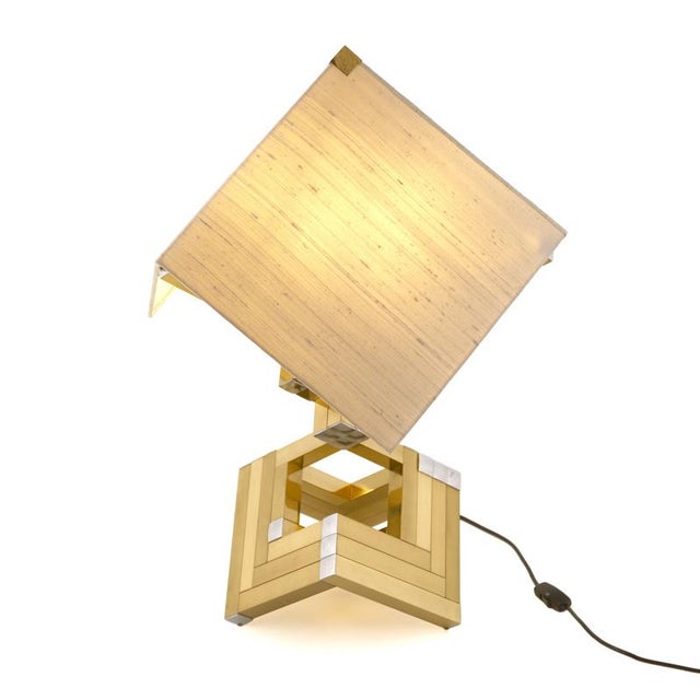 Magnificent pair of geometric table lamps with a brass and chrome frame and linen shade. They look fabulous from every...