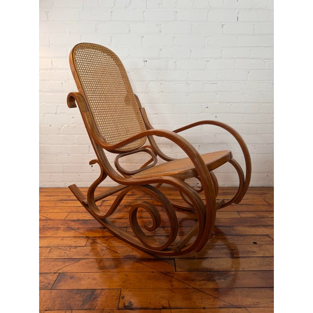 Thonet-style bentwood rocking chair with cane seat and back in fantastic vintage condition. This piece appears to have...