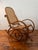 Thonet-style bentwood rocking chair with cane seat and back in fantastic vintage condition. This piece appears to have...