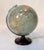 This early illuminated table world globe model 'Universum' was published by Süd-West Verlag Munich, and was produced under...