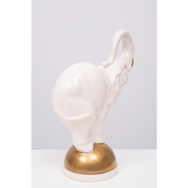 Hollywood Regency Large Ceramic Elephant on Golden Ball, 1970s For Sale - Image 3 of 9