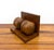 A distinctive pair of vintage wooden bookends featuring rounded sculptural forms with inlaid world map motifs. Crafted...