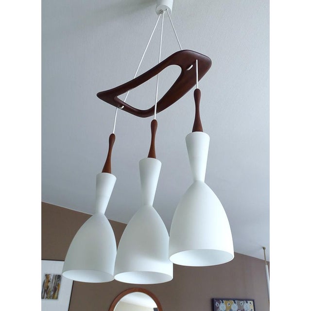 Large scandinavian style pendant light by the french company rispal featuringteak wood suspension platform and 3 large...