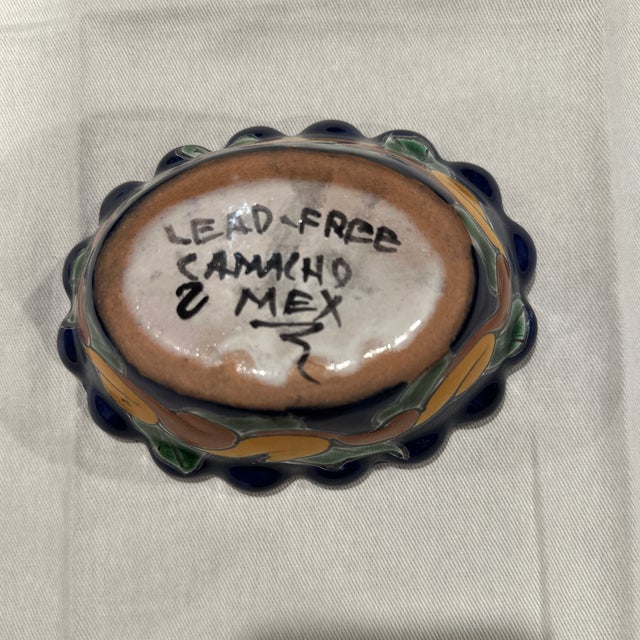 Used, mid-century, signed hand, painted ceramic trinket bowl. Vibrant colors.