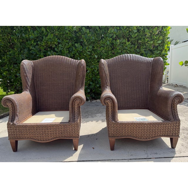 Beautiful vintage pair of Lane Venture Excursions wingback armchairs with substantial woven rattan frames, rolled arms,...