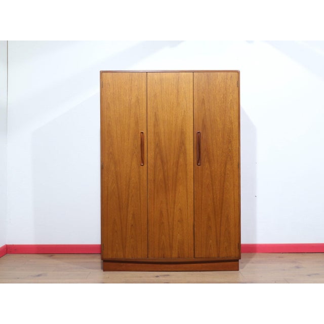 This stunning Danish style triple door Armoire in the syle of G Plan from the Fresco range is designed by VB Wilkins. It...
