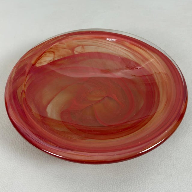 A glasswork of exceptional refinement and undeniable rarity, created by the renowned Swedish manufacturer Kosta Boda. This...