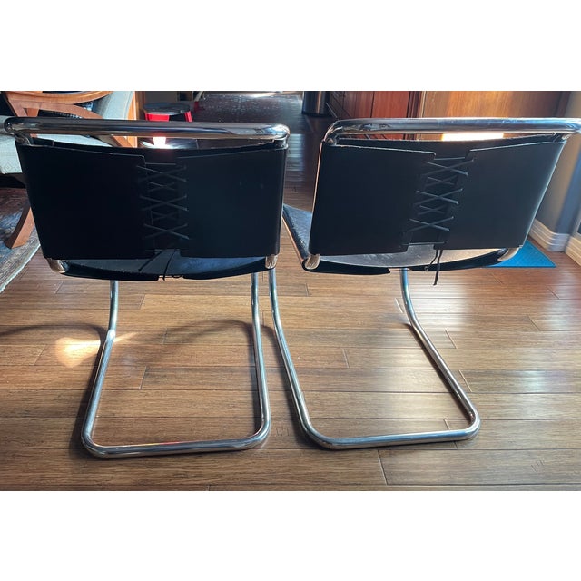 Pair of well-loved Mies MR10 Black Dining Chairs - original chrome/leather. Signs of wear on both seats, small tear on one...