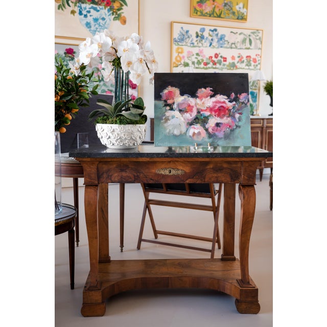 A beautiful console table crafted in richly figured walnut and topped with a striking black marble slab, circa 1820...