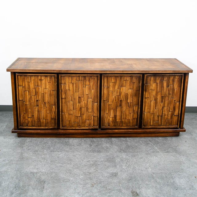American designed oak dresser with a unique patchwork design. This piece has 8 drawers within. Please note that the door...