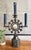Impressive mid-century hand-forged Mexican tin three-arm candelabra featuring a dramatic sunburst design with a central...