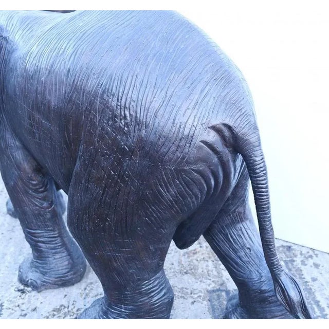 Amazing bronze casting of a cute elephant that measures over six feet tail to trunk - 193 CM Very characterful statue...