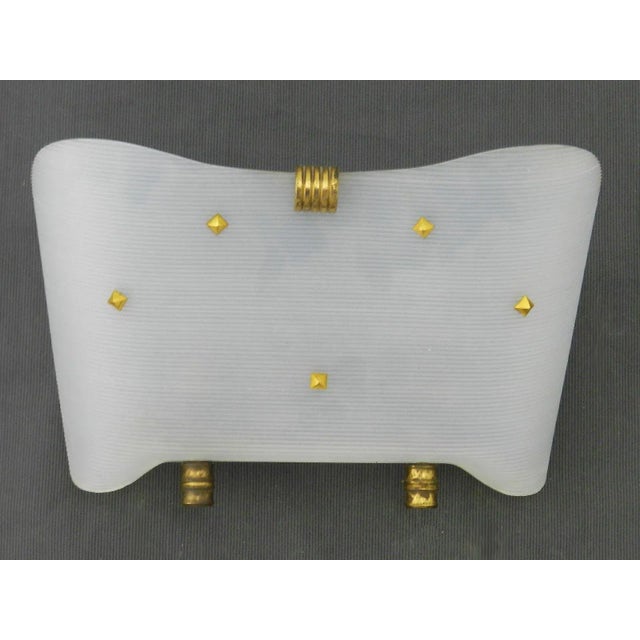 Midcentury pair of wall lights french manner of guariche. Undulated plastic shades with gold details, 2 bulbs in each...