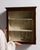 This piece presents as a cabinet, distinguished by dark mahogany, mirrored panel. It was made in France during 19th...