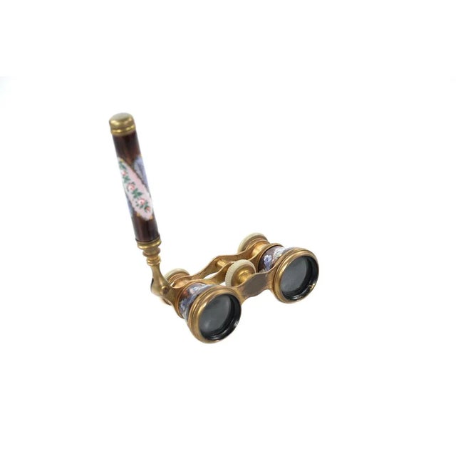 Antique 19th century French enamel and brass opera glasses. Size: 2" x 5" A beautiful piece that will add to your décor!
