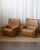These spacious vintage Swiss leather lounge chairs from the 1970s are all about easy comfort and clean design. Wrapped in...