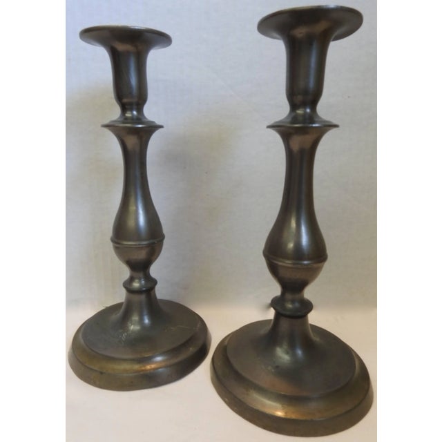 These are classic Colonial style tall candlesticks to add beauty to your surroundings. The graceful lines to you back to...