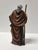 This Italian Baroque style shepherd figurine presents an elderly male figure standing in a humble posture, leaning...