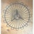 This vintage wire basket is constructed in a striking radial, sunburst pattern, with slender metal spokes fanning outward...