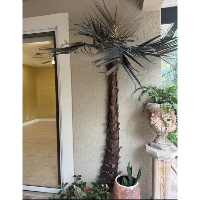 Striking large-scale 1970s artist-made palm tree wall sculpture crafted in copper and brass. The piece has a dramatic...