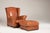 Leather Baxter armchairs with poufs. The set of 4 pieces can be split. The price refers to the complete set of four. A...