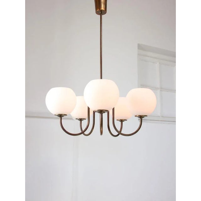 Made of copper plated brass (not iron). Takes 5x standard E14 light bulb (not included). Works with 220v as well as 110v....