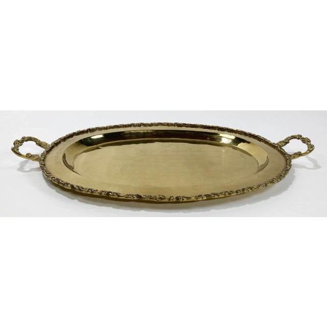 Stunning large vintage brass tray featuring scrolled edge. Substantial handles to each end. Elegant and functional, this...