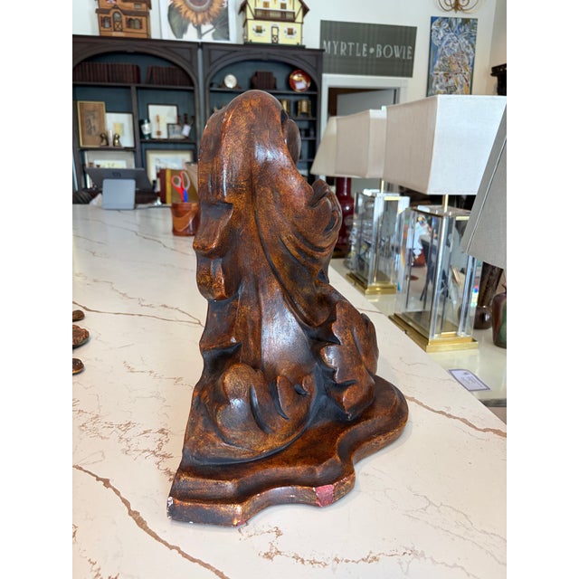 Vintage carved acanthus wall bracket made in the 1980s, featuring bold scrolling foliage and a rich walnut-toned finish....