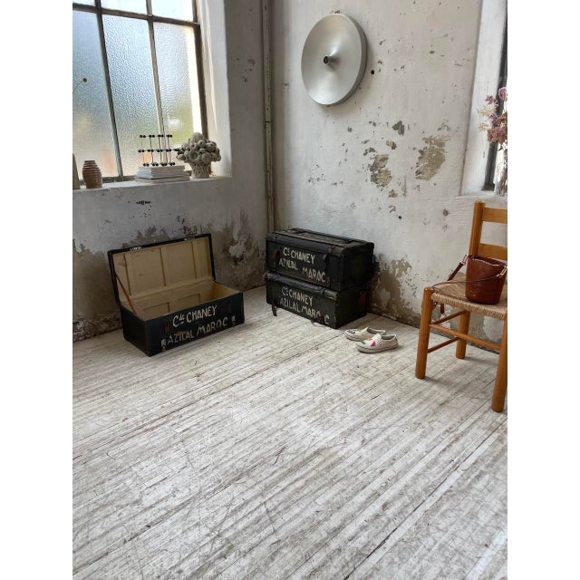 Old wooden trunks patinated by time with their handwritten inscriptions. These trunks have the inscriptions Commander...