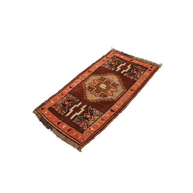 Vintage Handknotted decorative mini rug from Kars region of Turkey. Approximately 45-55 years old. In very good condition.