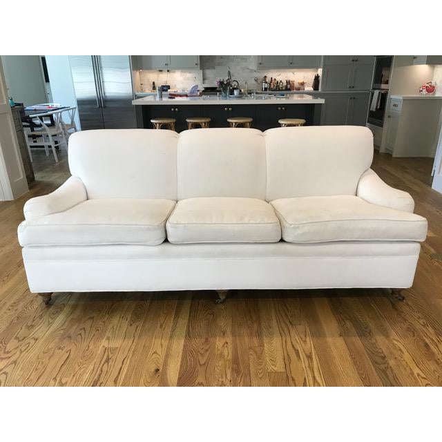 Immaculate white English-rolled arm sofa with Ralph Lauren fabric. Brass castors on legs. Excellent condition and fabric...