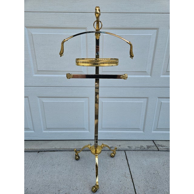 This gorgeous brass and chrome valet on casters features a ram’s head with a ring in its mouth and hooves at the end of...