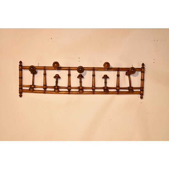 Circa 1900 hand-turned cherry coat and hat rack from France. The rack is made in the faux bamboo style, which has remained...