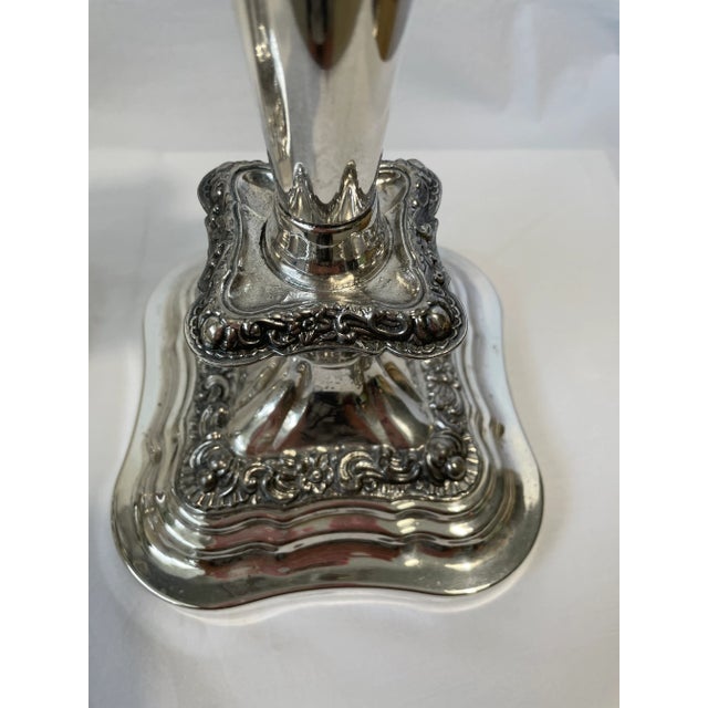 Beautifully ornate pair of silverplated candlesticks. These will make a statement in any room. Heavy.