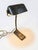 Elevate your workspace with a piece of French industrial history. This authentic desk lamp was manufactured by NIAM...