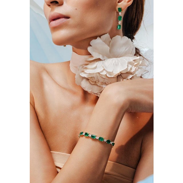 This is part of Chairish’s Fine Jewelry assortment. This Octagon Emerald Diamond Tennis Bracelet in 18K gold showcases 10...