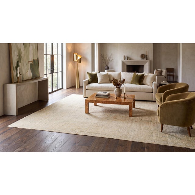 Bring serene luxury and timeless elegance into your living space with this modern Oushak-inspired area rug. Meticulously...